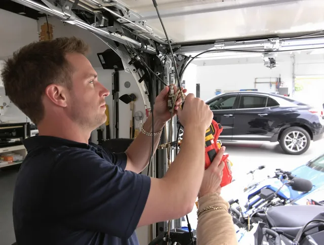 Bell Gardens Garage Door Repair safety certified technician performing cable replacement in Bell Gardens