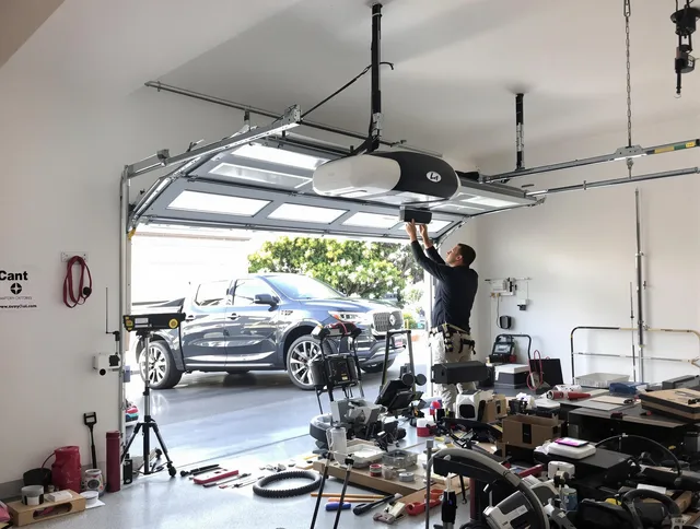 Bell Gardens Garage Door Repair specialist installing smart garage door opener system in Bell Gardens home